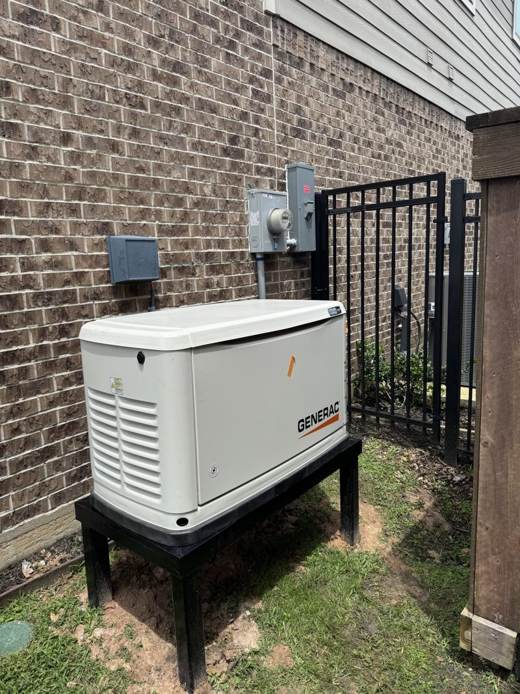 Generac generator on an elevated stand beside a gated side yard