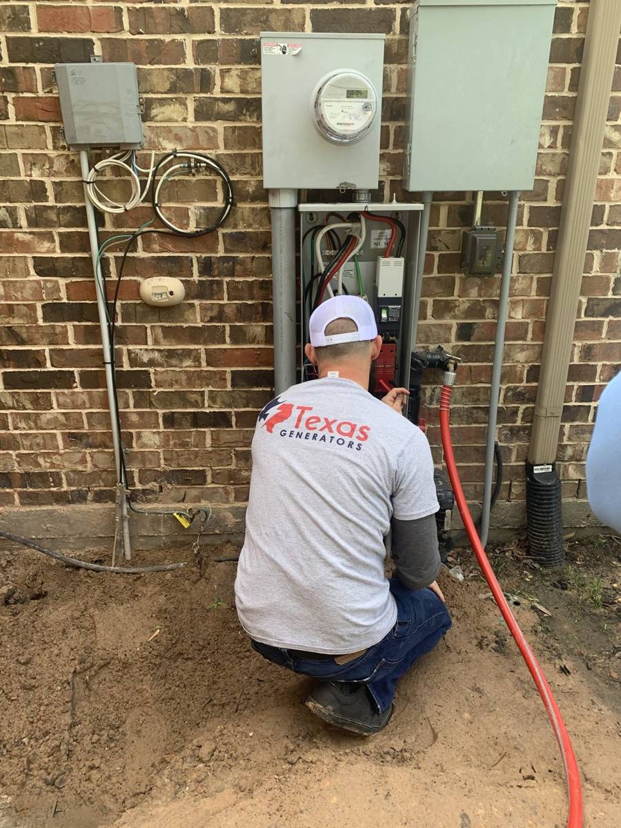 Texas Generators technician wiring a transfer switch