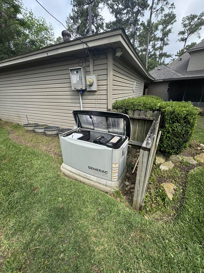 Generac generator with its cover open for service